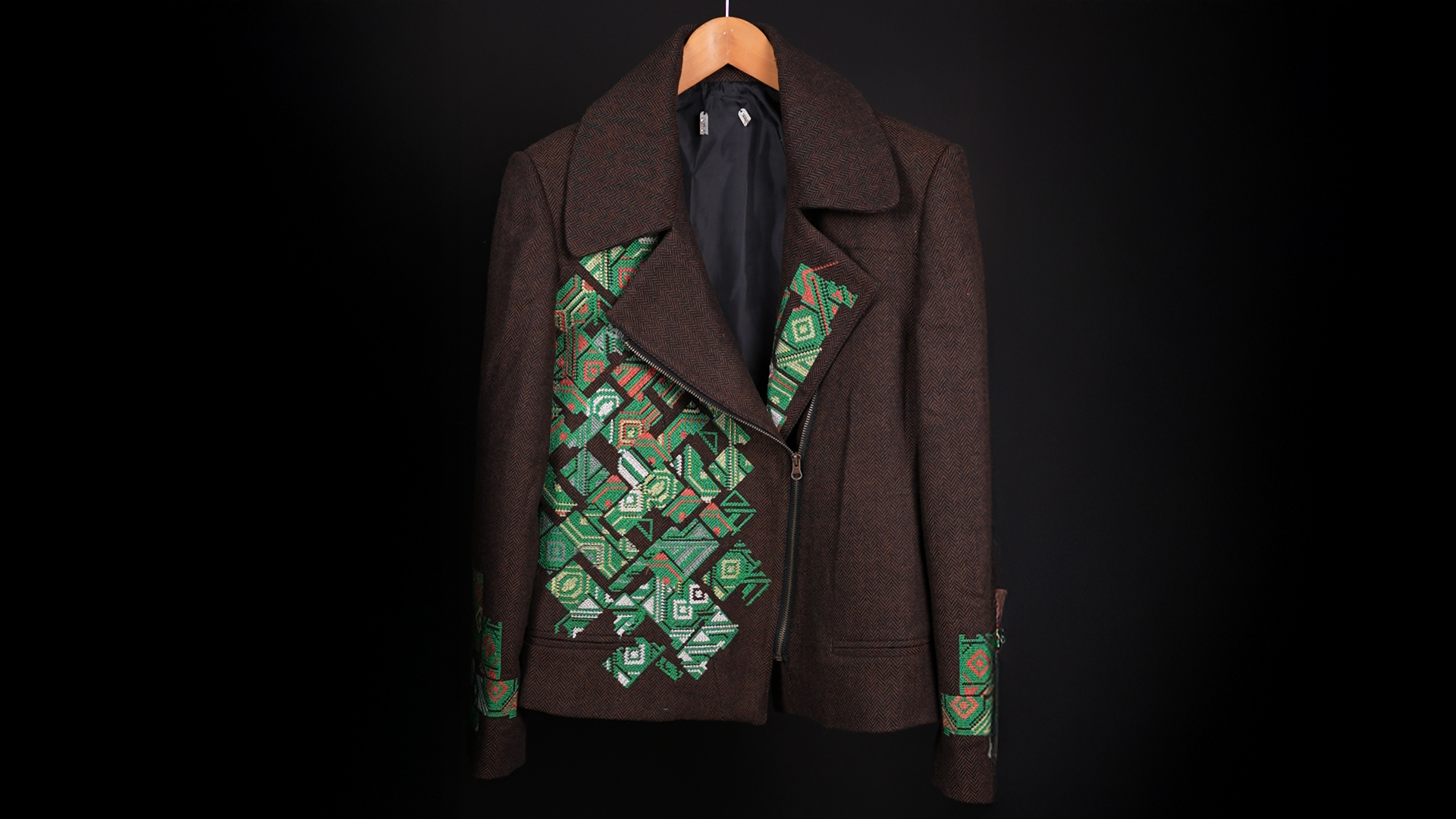 Brown wool jacket with green geometric embroidery